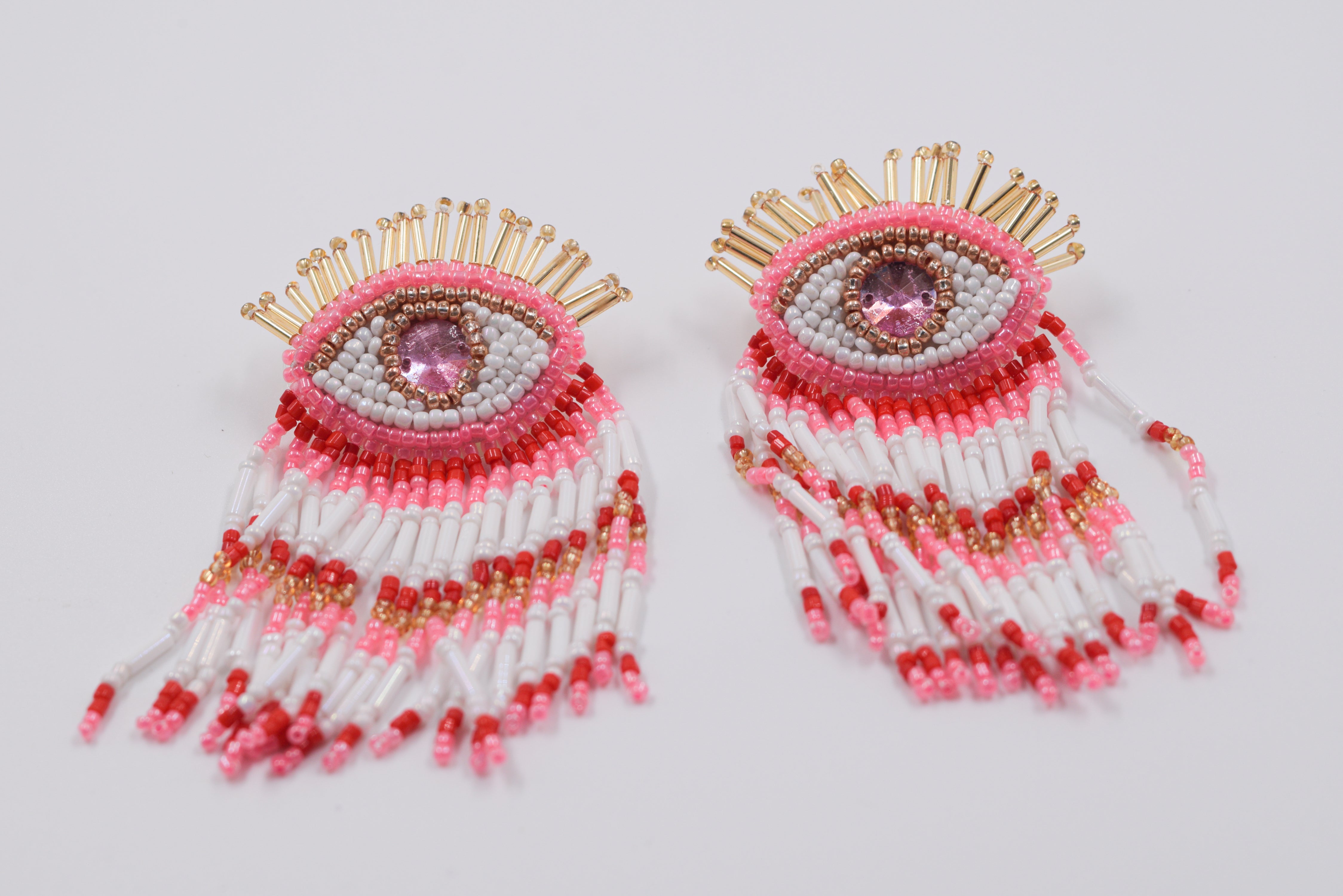 boucle d'oreille en perle motif oeil